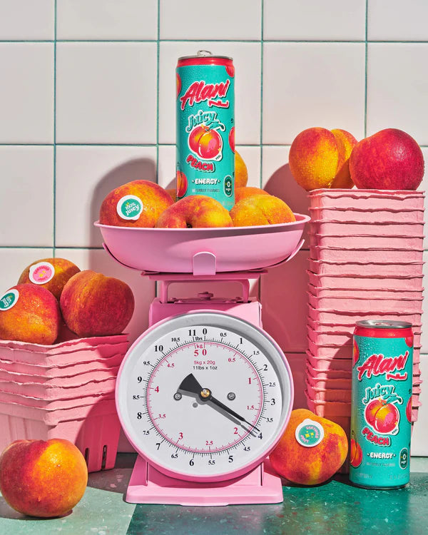 Alani Nu Juicy Peach Energy Drink lifestyle photo — sugar-free 12 pack